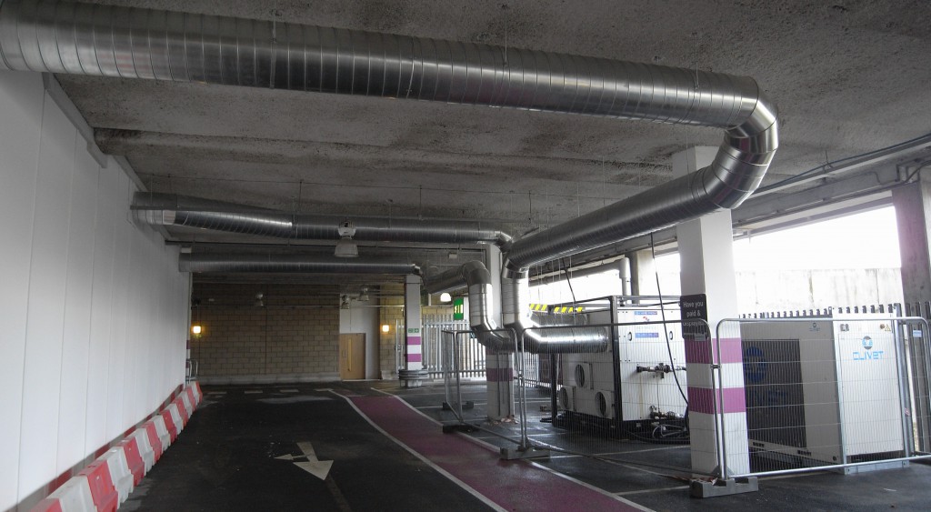 The temporary HVAC system installed at the Olympic Excel Fleet Depot. An ACS 160.120 climate control air handler was used with a 110kw chiller. External ductwork was made in solid Spiral with a fabric air sock system fitted internally.