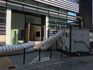 AHU's fitted outside a data centre. Cooled air is sent in through ducting.
