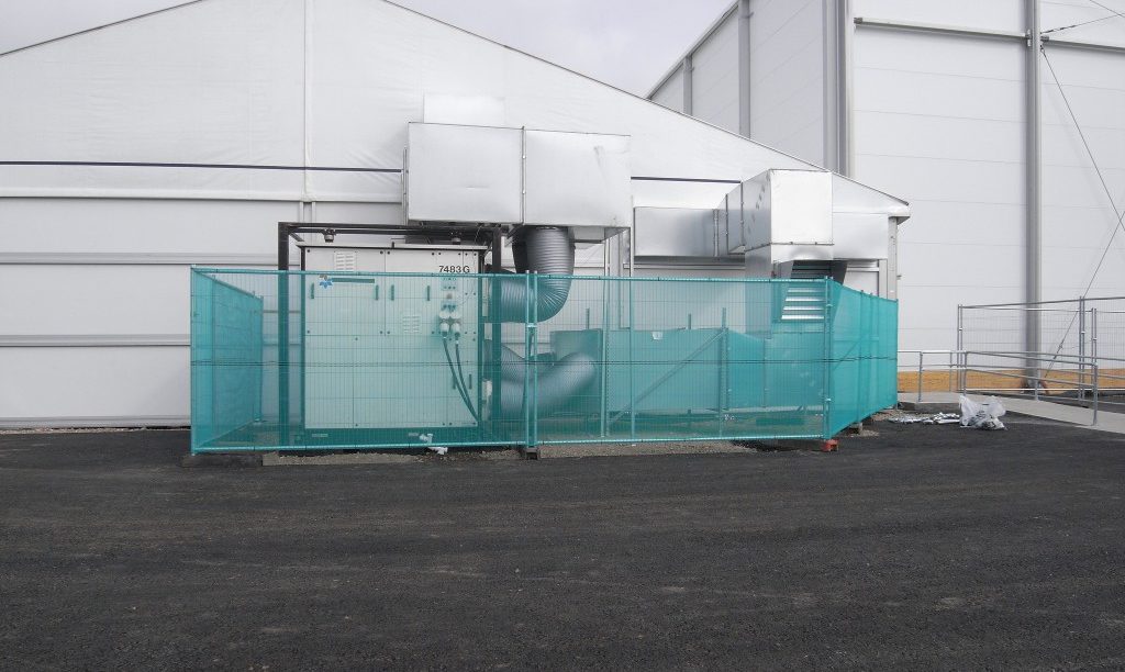 A ventilation, air conditioning AHU fitted alongside a temporary building sports facility.