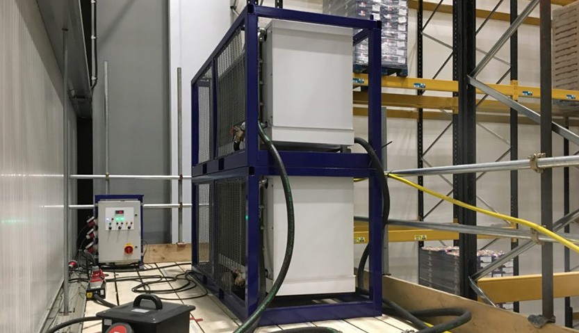 two 25kw low temperature AHU's stacked and mounted on a scaffolding platform
