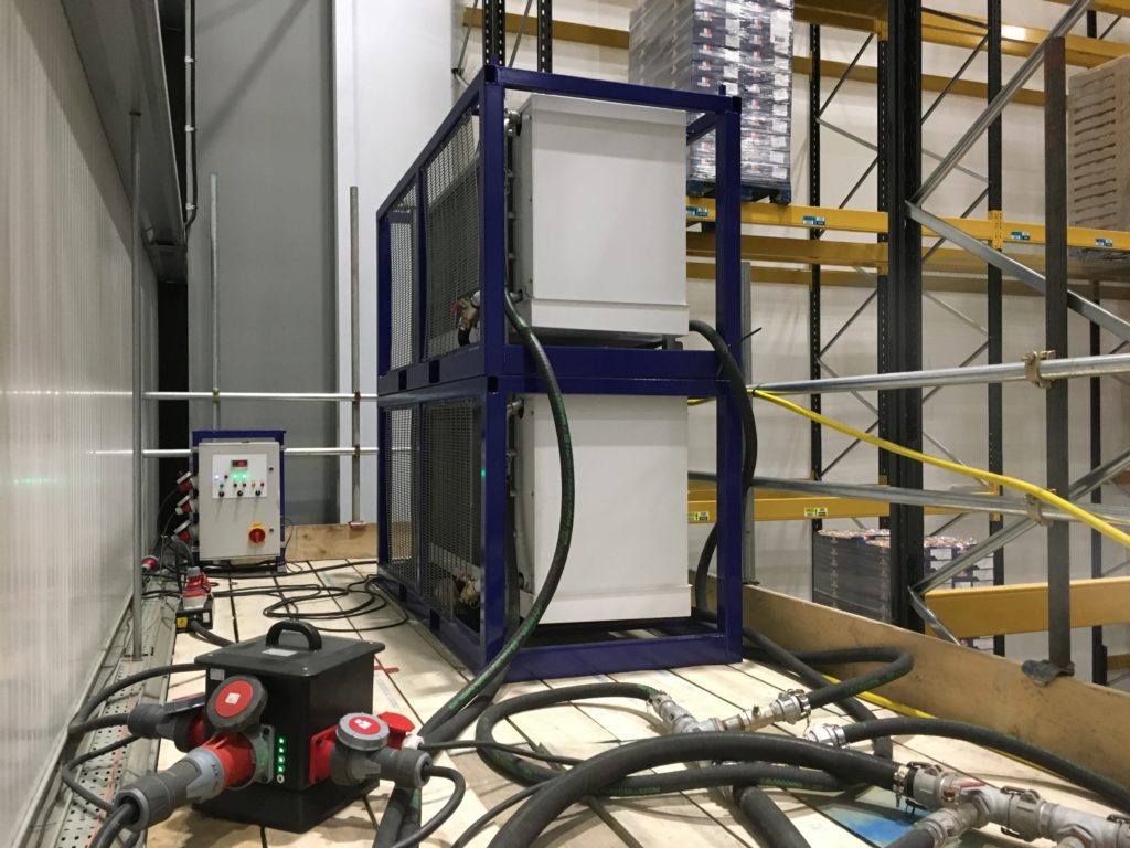 two air handling units with chilled water hosing, controller and power distribution.